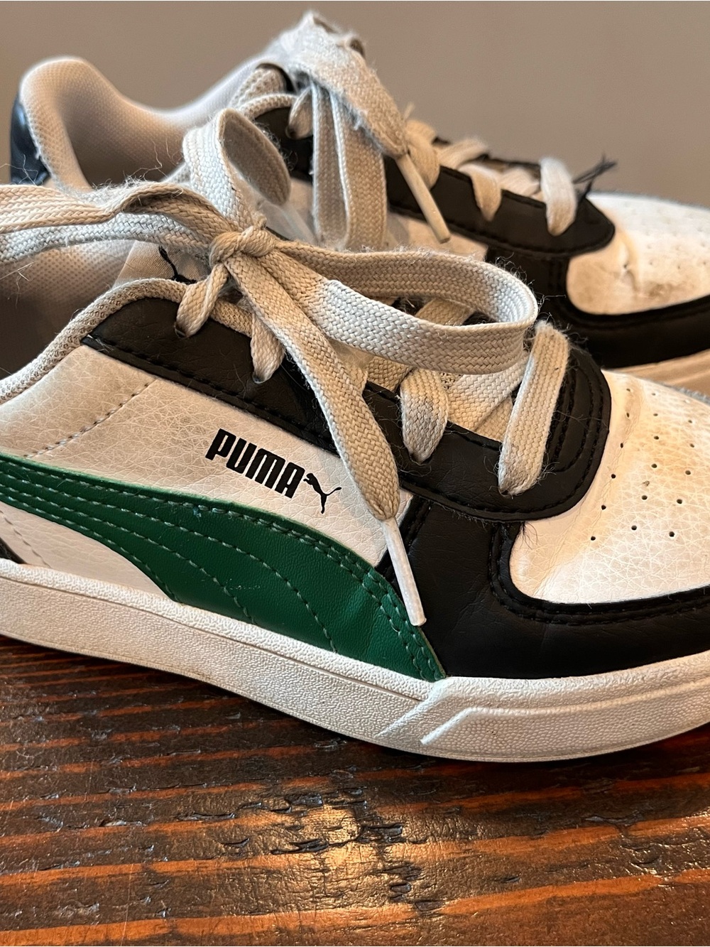 Puma Kids Black and White Low-Top Sneakers with Green Accent